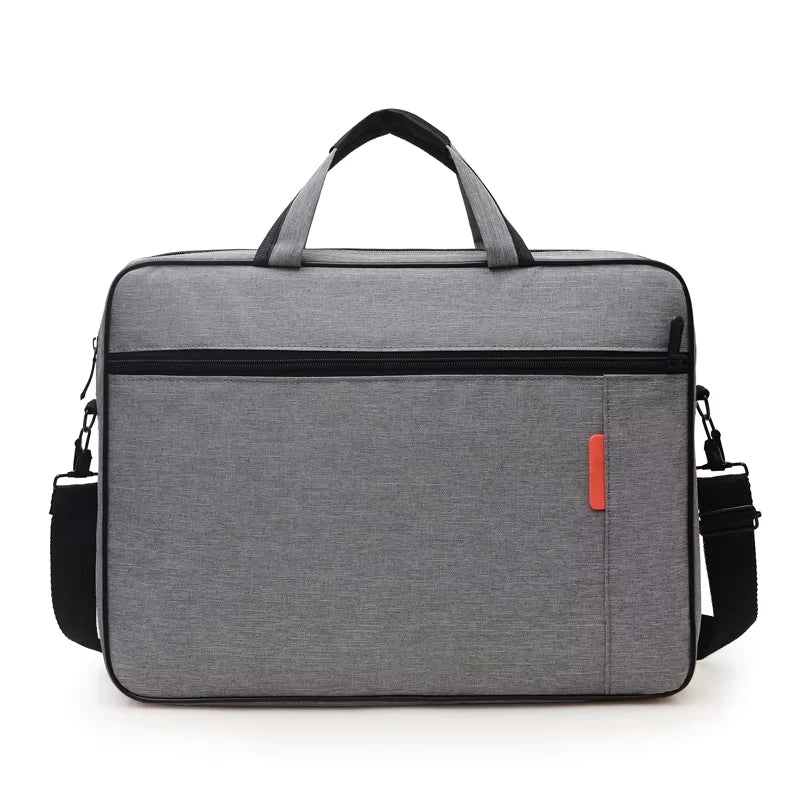 Grey padded laptop carry bag with twin handles, front zip pocket and shoulder strap