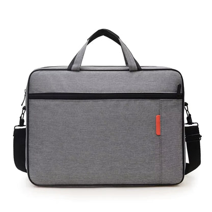 Grey padded laptop carry bag with twin handles, front zip pocket and shoulder strap